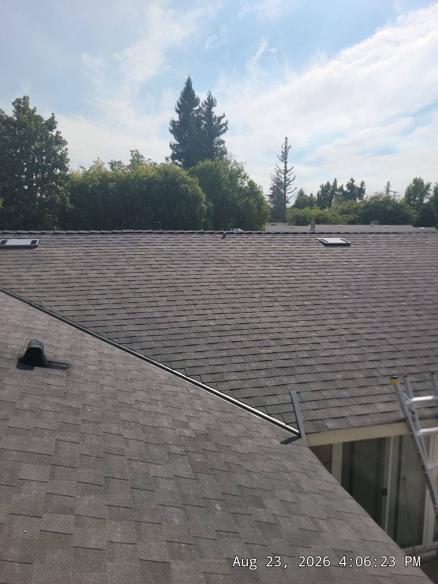 Clean shingle lines and ridge on a finished roof